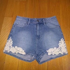 BDG high-waisted denim shorts with lace trim